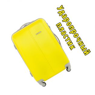 Пластиковый чемодан на четырех колесах насыщенно-лимонный